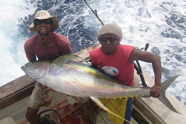 Crew of the "Happy Hooker" with yellowfin tuna